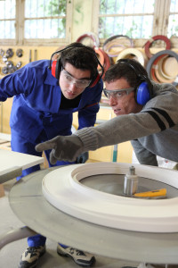 Carpenter and apprentice in workshop shutterstock_64364530